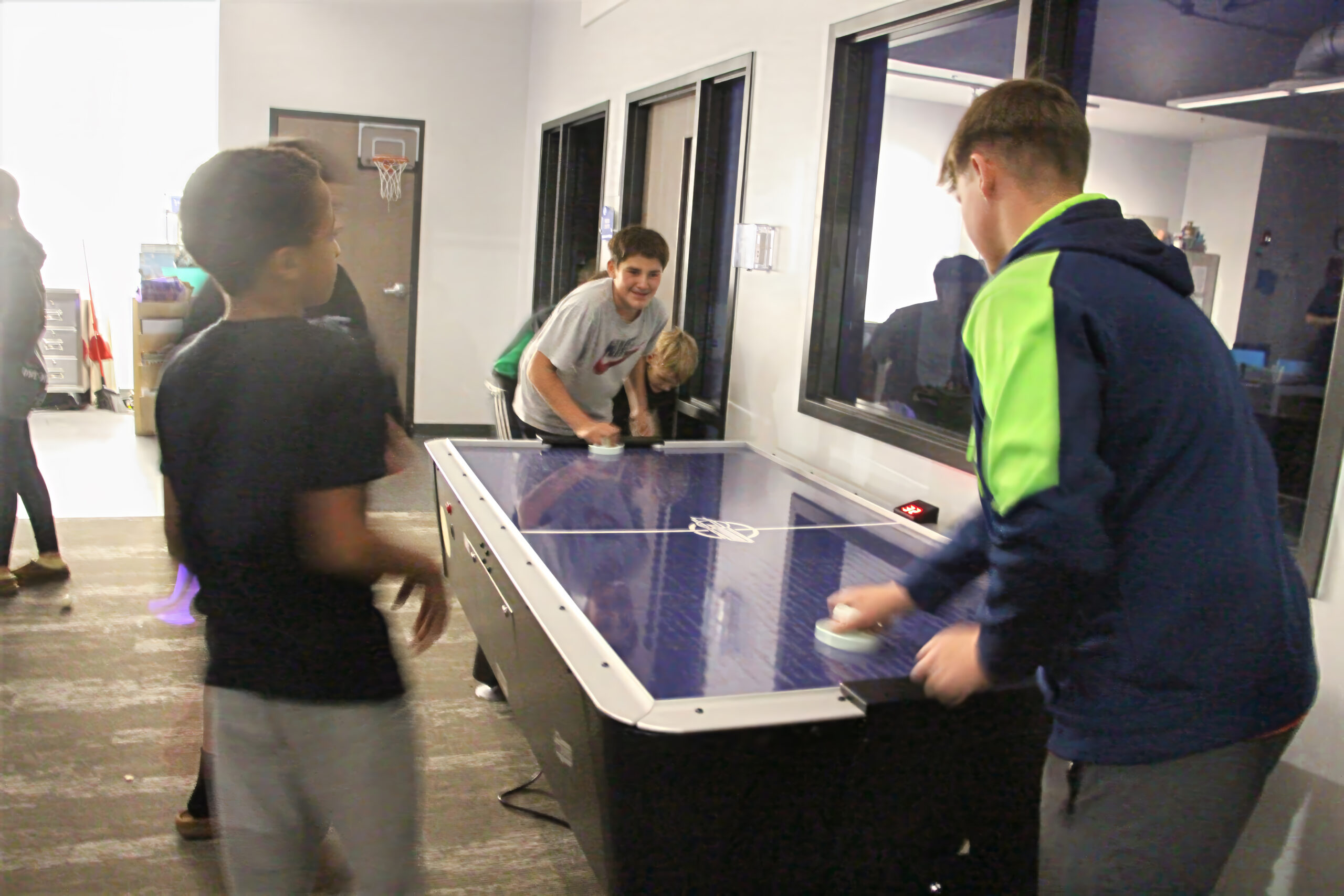 boys playing air hockey