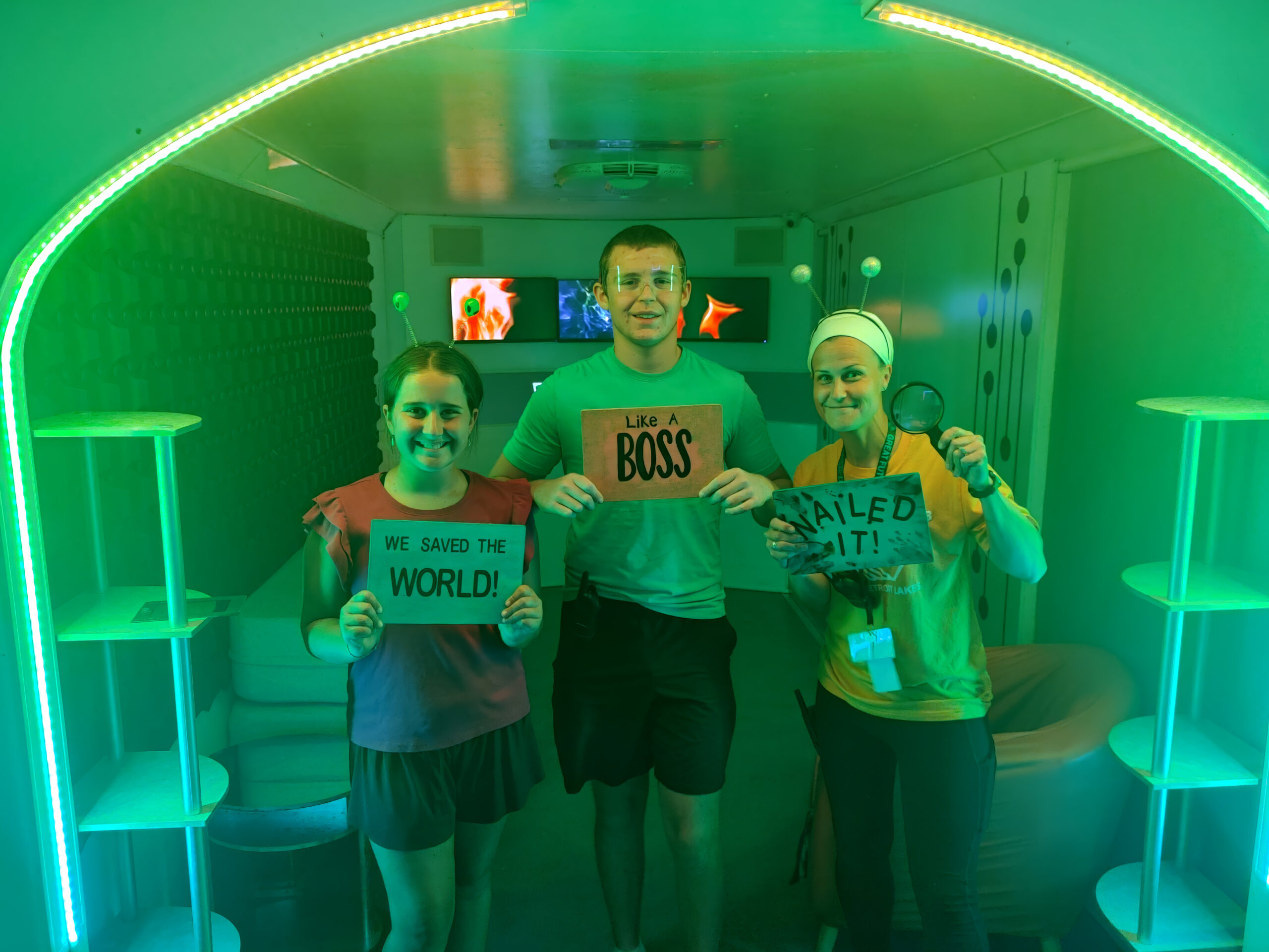 teens with a mentor in a green glow room