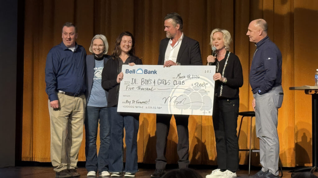 Check presentation to Patrick Petermann and Carrie Johnston from Josh Duhamel and Bell Bank Representives